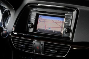 The navigation and radio screen is small with tiny on screen buttons and little volume and tuning knobs.