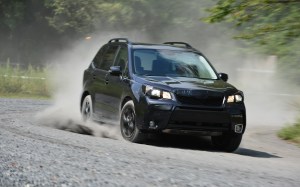 A black pre-production Forester reflects its Darth Vader looks.