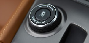 You can dial in your driving mode with this dial on the console.
