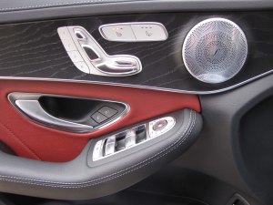 Power seat controls are on the beautifully trimmed door, and the Burmeister speaker looks like some of Mr. T's jewelry.