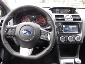 Good gauges and love the flat-bottomed steering wheel here.