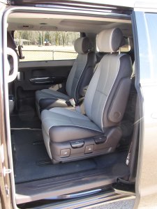 Side doors slide wide open for easy access to the second and third-row seats, an attractive two-tone in the test van.