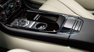The shifter is a metal knob that rises from the console on the Jag.