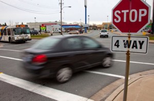 stop sign optional, rolling stops, drivers who roll through stop signs
